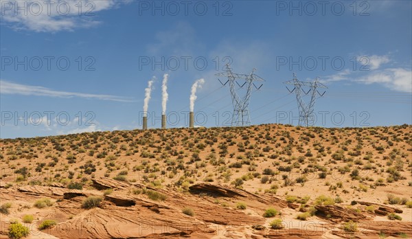 Power plant in distance on Navajo reservation in Arizona.