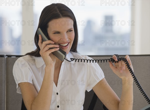 Businesswoman talking on telephone.