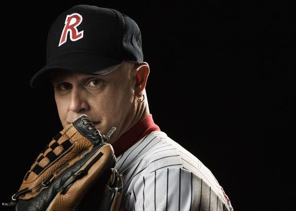 Portrait of pitcher with baseball glove. Date: 2008