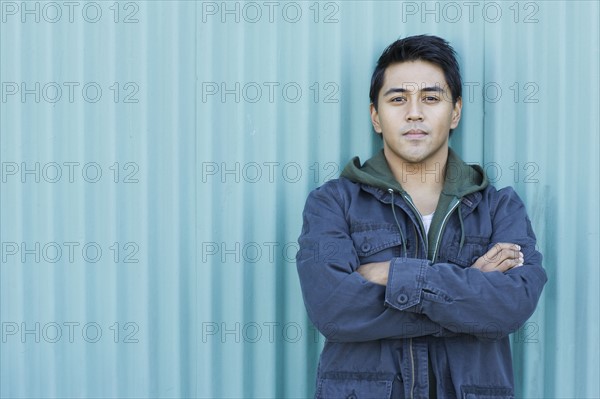 Man posing with arms crossed. Date : 2008