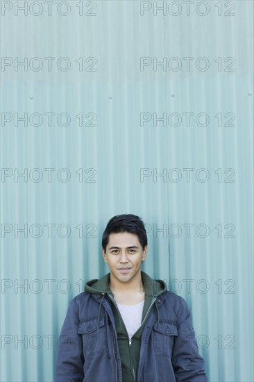 Man posing against wall. Date : 2008