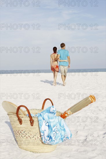 Couple walking on beach. Date : 2008