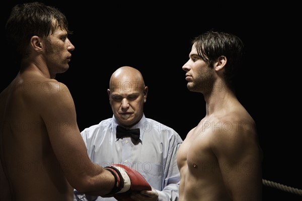 Referee checking boxer’s gloves. Date : 2008