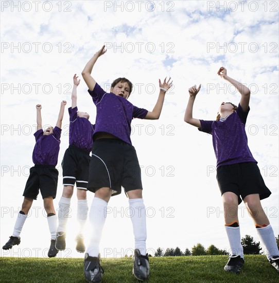 Boys soccer team celebrating on field. Date : 2008