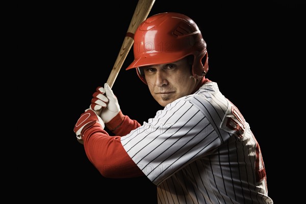 Portrait of batter holding baseball bat. Date : 2008