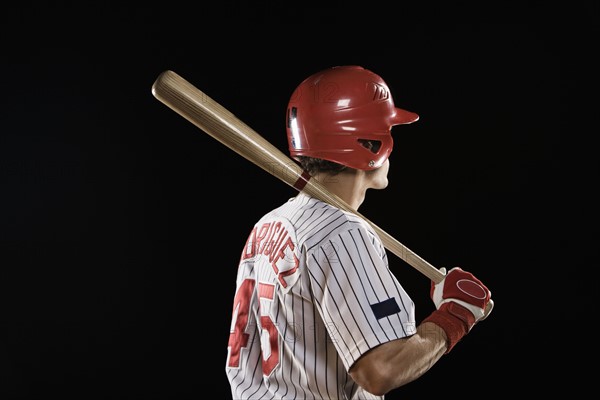 Baseball player standing with bat. Date: 2008