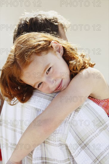 Portrait of father holding daughter. Date: 2008