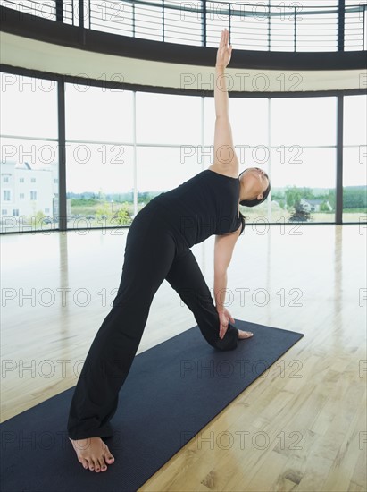 Woman in triangle pose. Date : 2008