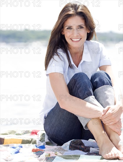 Portrait of woman sitting on blanket. Date : 2008