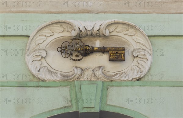 Gold key plaque to identify house, Prague.