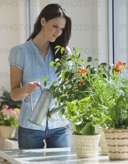 Woman watering plants.