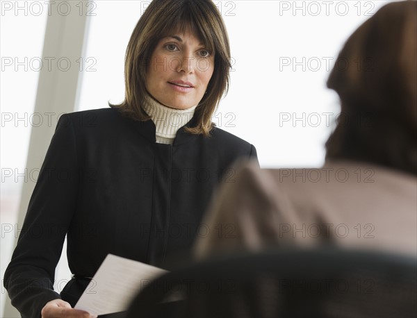 Businesswomen talking.