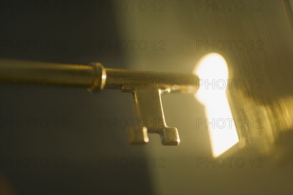 Close up of keyhole and key.