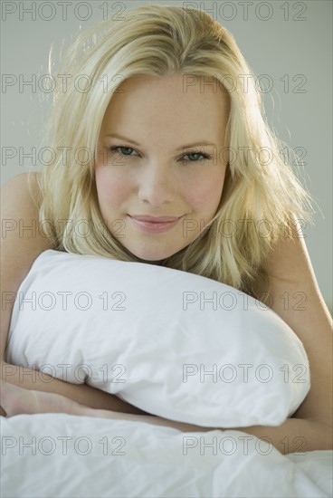 Woman relaxing on bed.