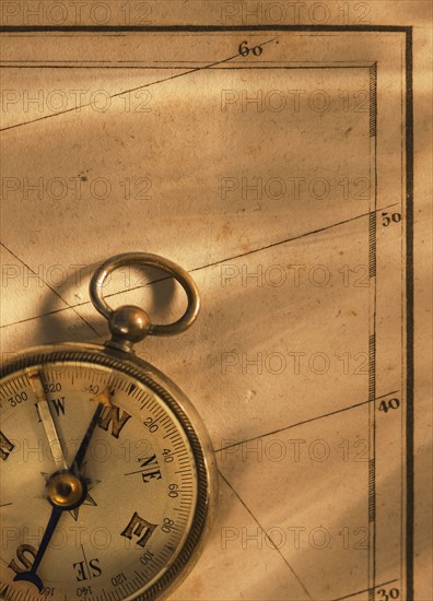 Close up of antique map and compass.