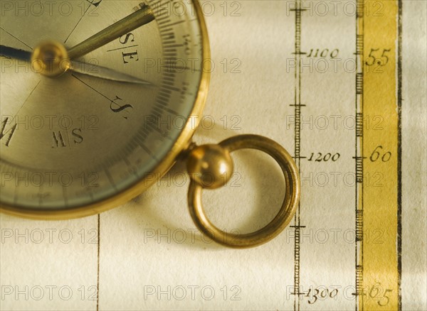 Close up of antique map and compass.