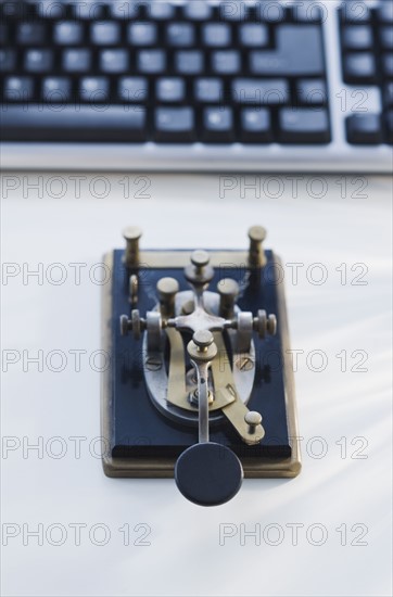 Antique telegraph key and keyboard.