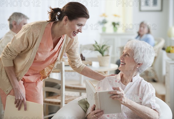 Senior woman reading book.