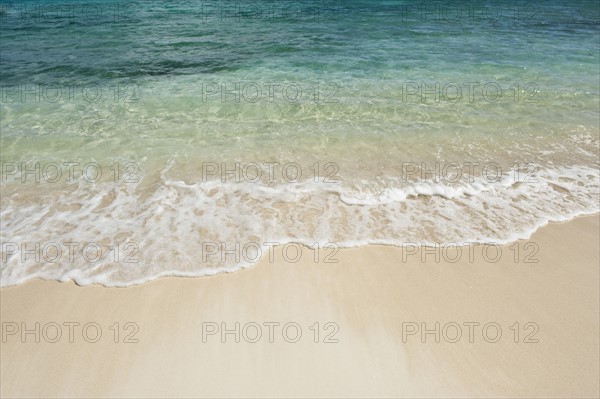 Beach and clear ocean water.