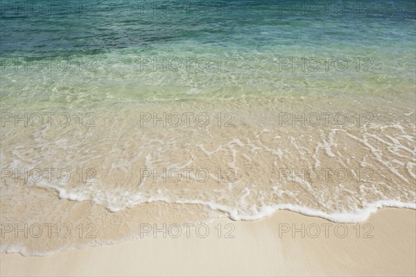 Beach and clear ocean water.