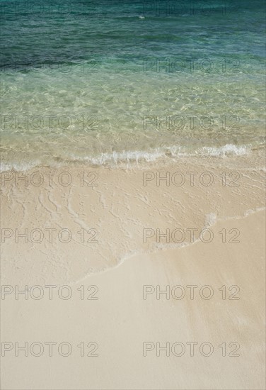 Beach and clear ocean water.