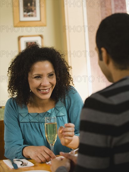 Couple drinking wine in restaurant.