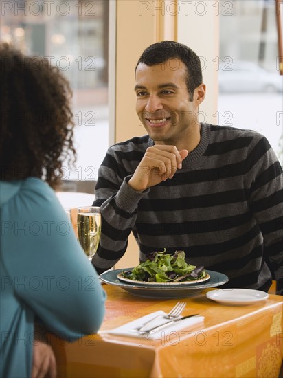 Couple eating in restaurant.