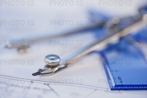 Drawing compass and blueprints. Photographe : Daniel Grill