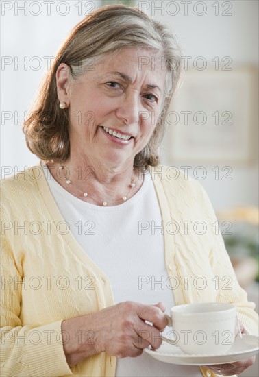 Senior woman drinking tea.