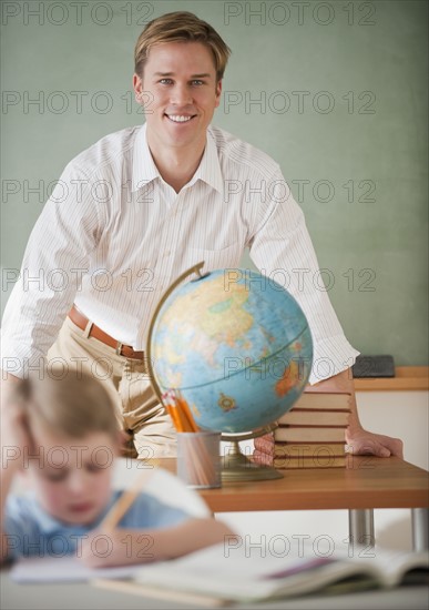 Teacher and student in classroom.