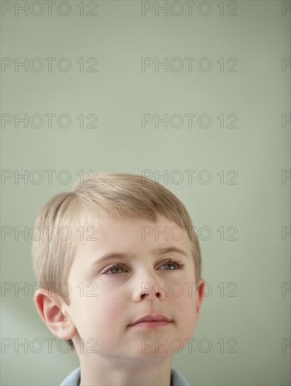 Portrait of boy looking up.