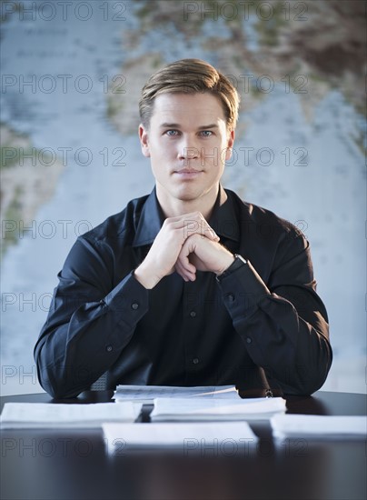 Portrait of businessman in office.