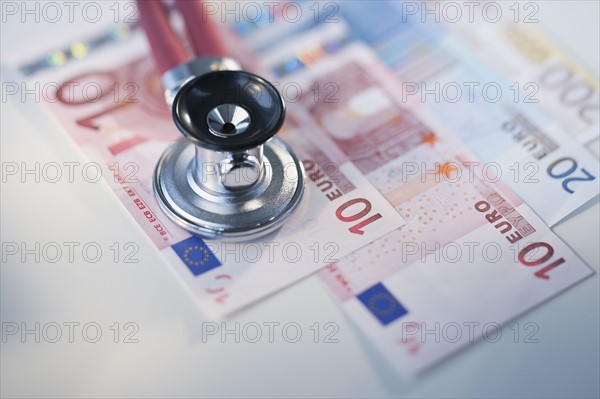 Euros and stethoscope.