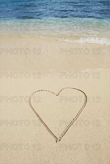 Heart drawn in sand.
