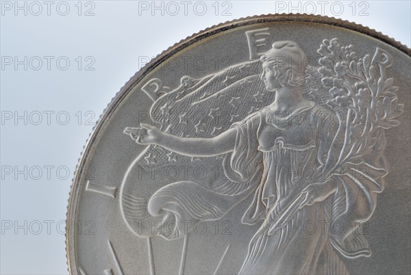 Close up of silver coin.