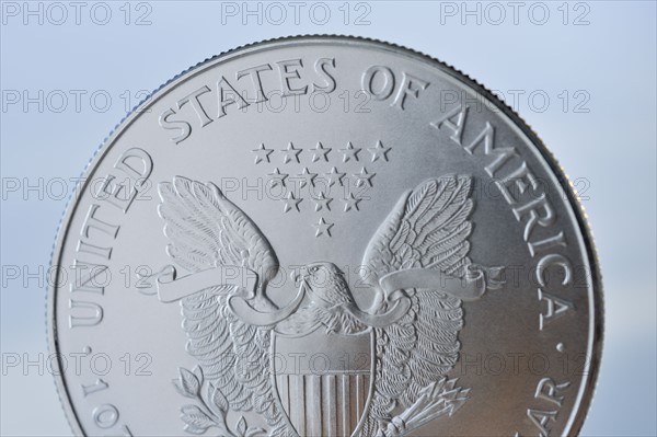 Close up of silver coin.