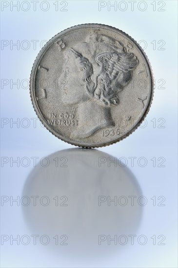 Close up of silver coin.