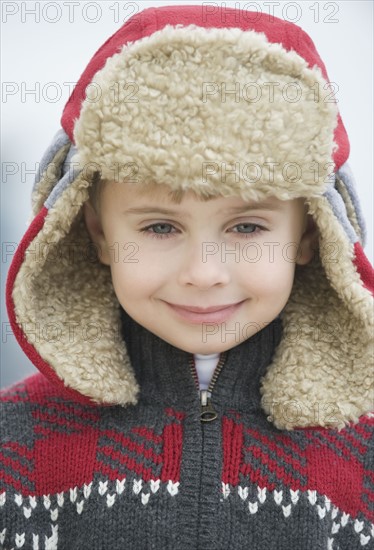 Boy wearing winter hat.