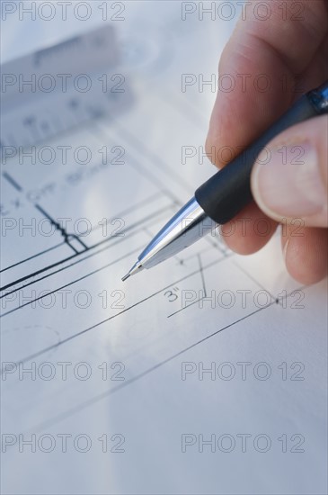 Man drawing blueprints.