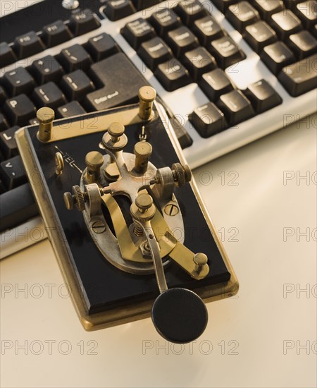 Antique telegraph key and keyboard.