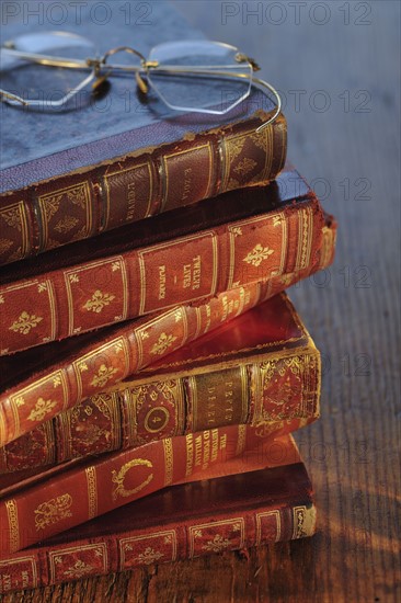 Antique books and eyeglasses.