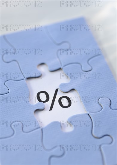 Puzzle and percent sign.