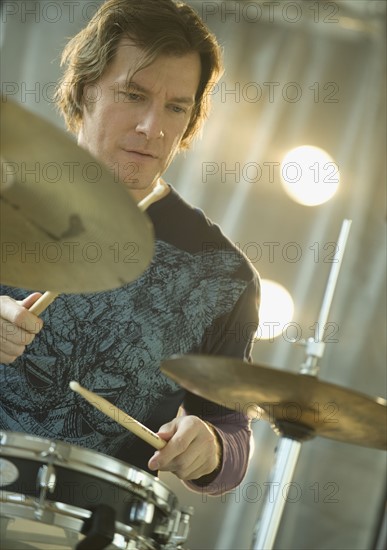 Man playing drums.