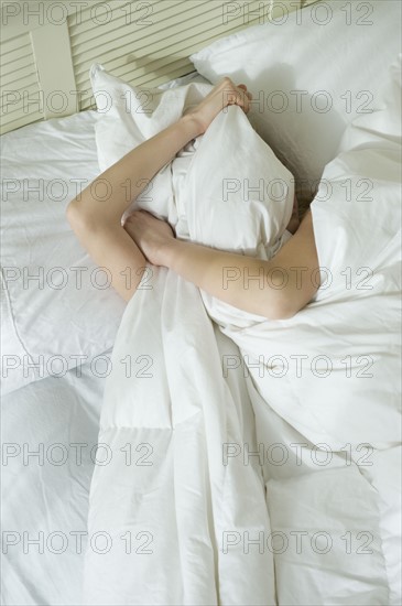 Woman sleeping in bed.