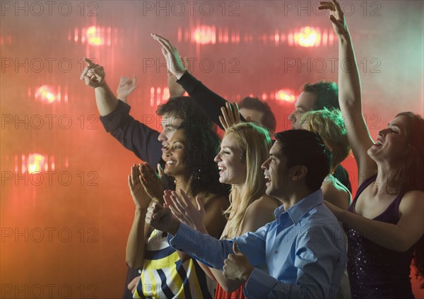 People enjoying concert.