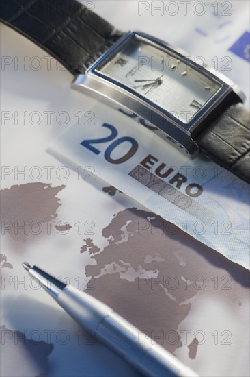 Euros and wristwatch.