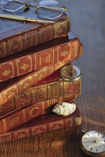 Antique books and compasses.