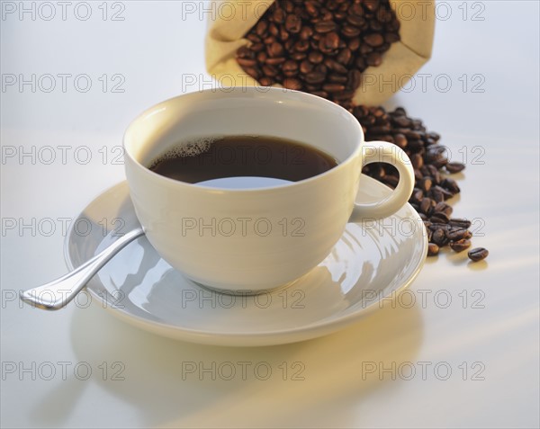 Coffee cup and coffee beans.