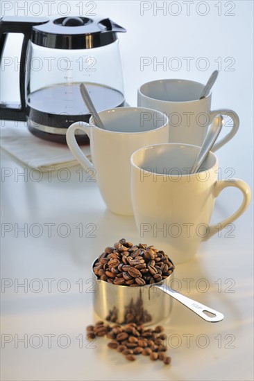 Coffee cups and coffee beans.