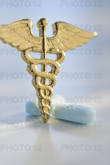 Prescription medicine and caduceus.